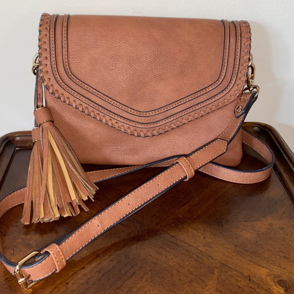 Brown convertible crossbody bag/clutch with two oversized tassels
